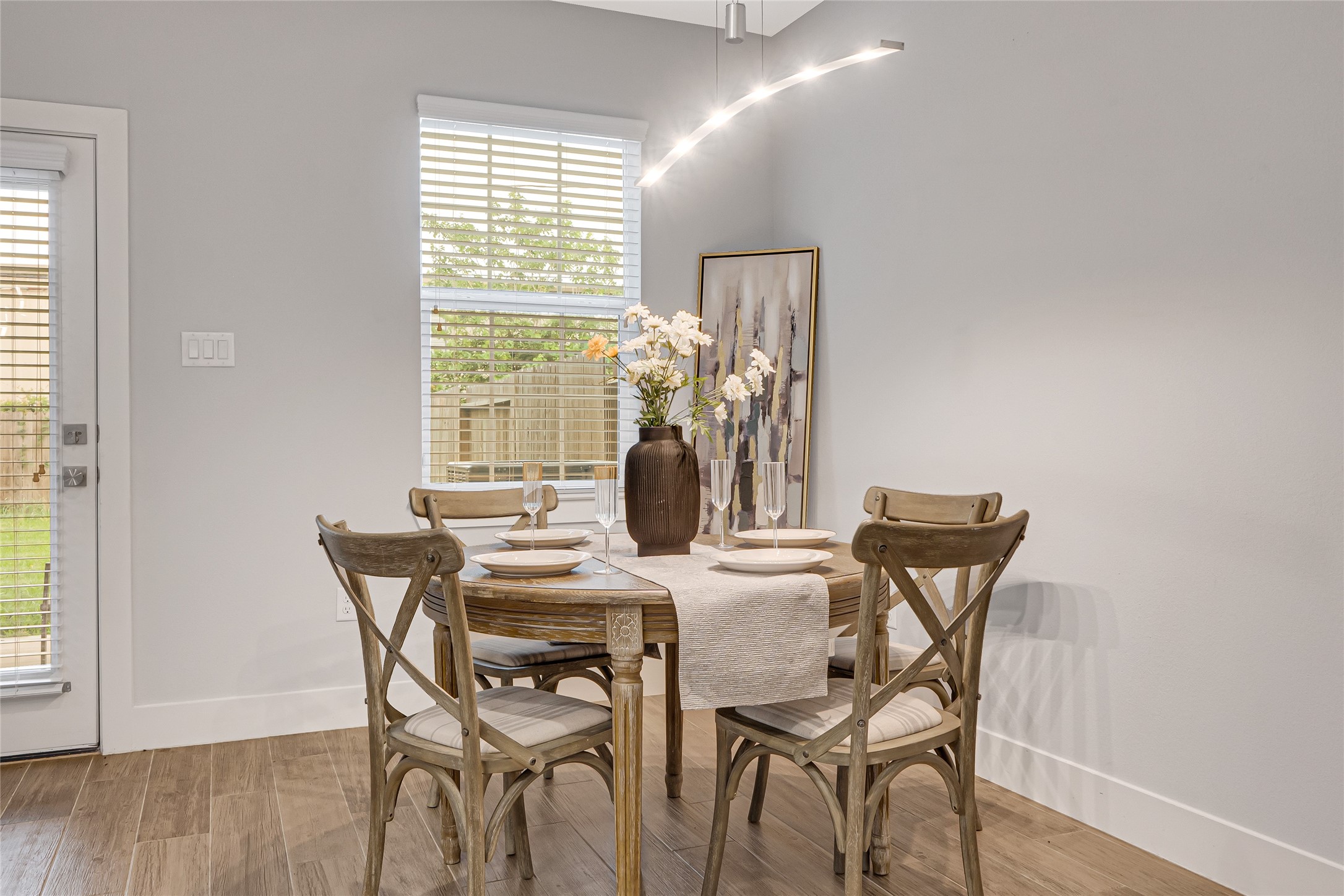 10021 Alfred Lane, Unit A Houston, TX 77041 - Photo 11 of 29 a view of a dining room with furniture and wooden floor