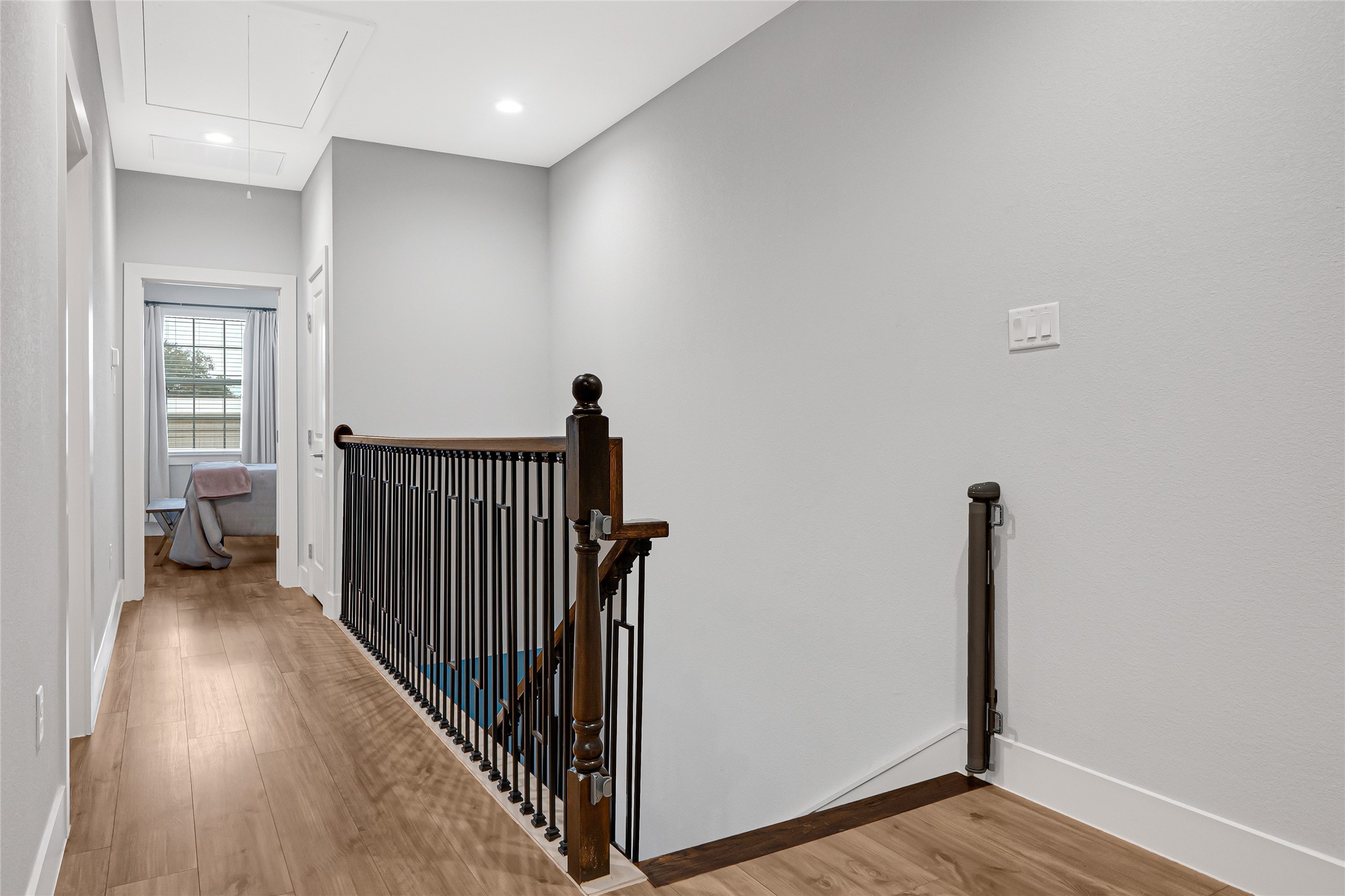 10021 Alfred Lane, Unit A Houston, TX 77041 - Photo 14 of 29 a view of a hallway with a room and wooden floor