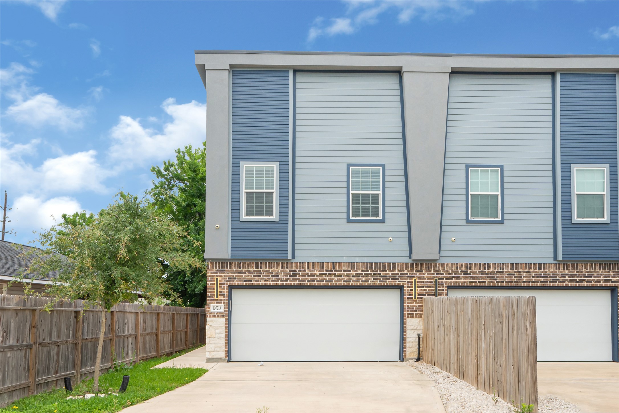 10021 Alfred Lane, Unit A Houston, TX 77041 - Photo 2 of 29 a front view of a house with a garage
