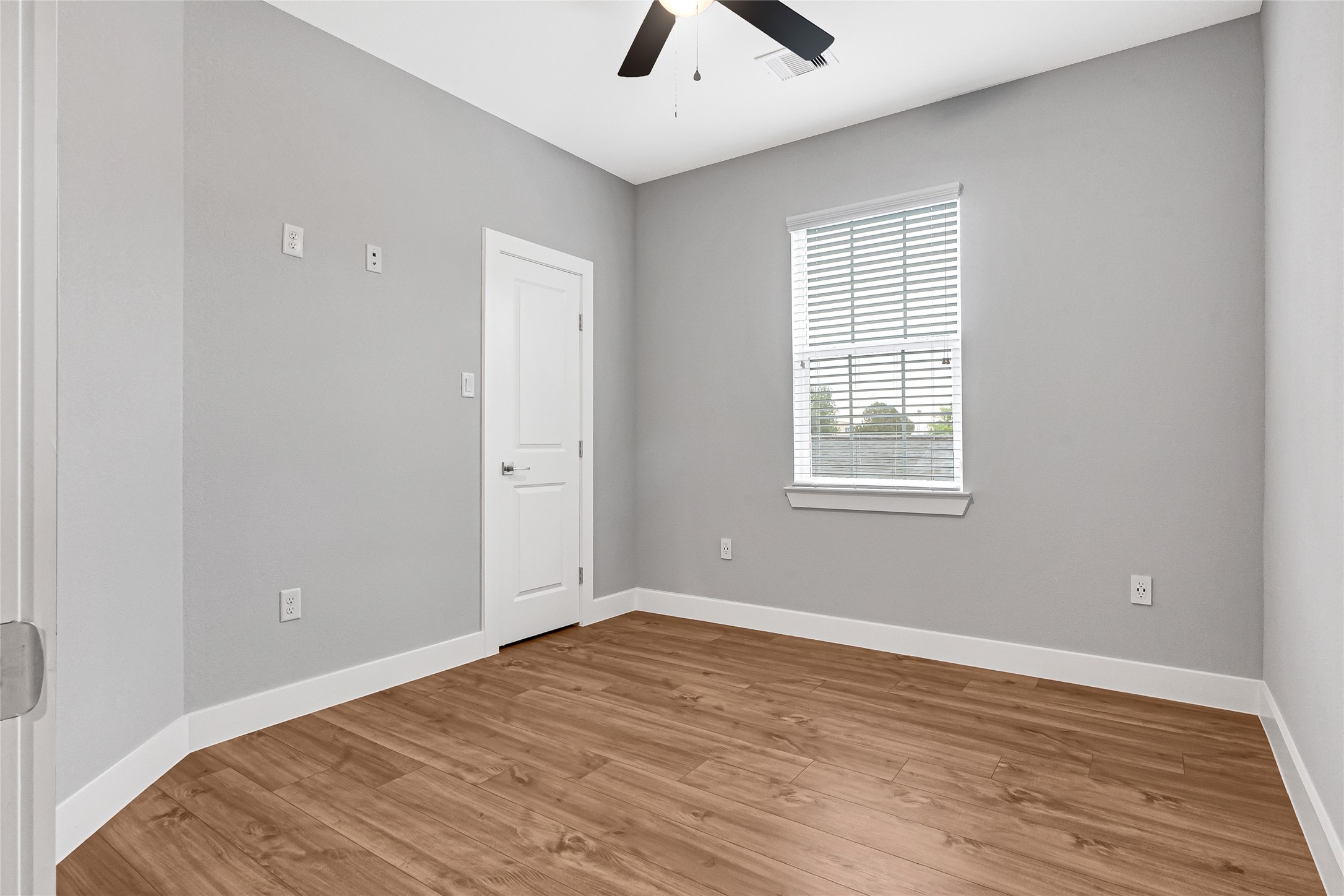 10021 Alfred Lane, Unit A Houston, TX 77041 - Photo 21 of 29 wooden floor in an empty room with a window