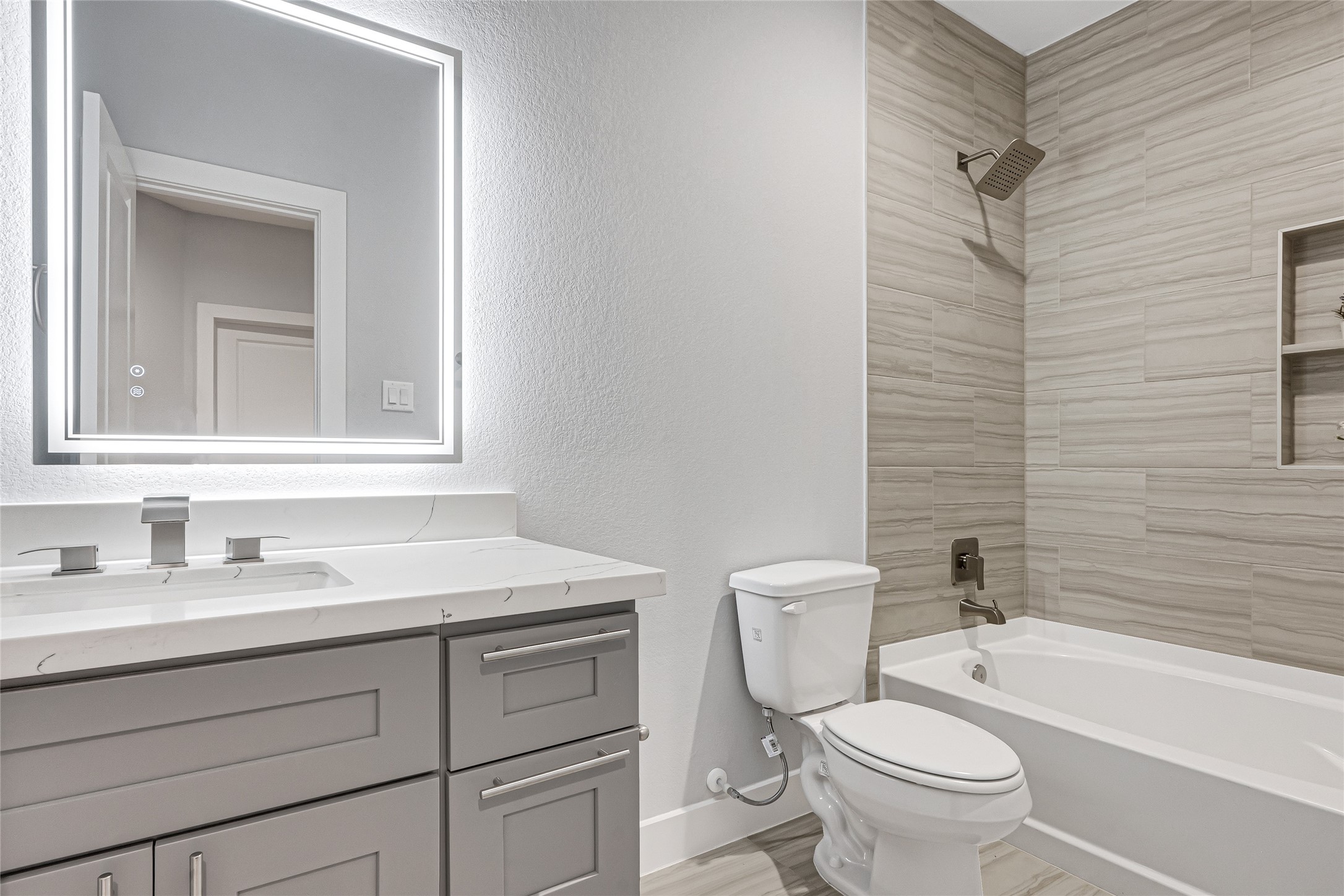 10021 Alfred Lane, Unit A Houston, TX 77041 - Photo 23 of 29 a bathroom with a toilet sink vanity tub and mirror