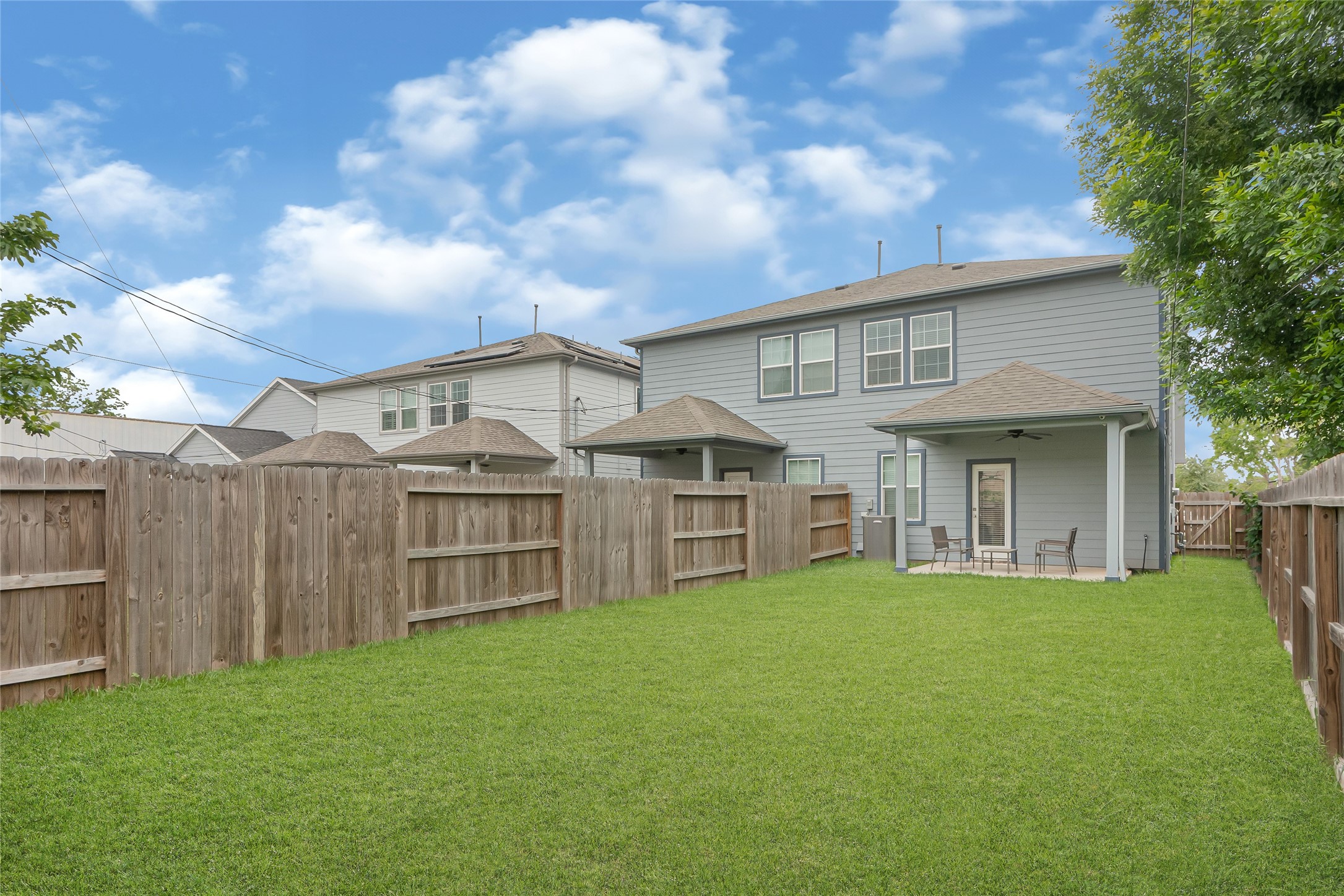 10021 Alfred Lane, Unit A Houston, TX 77041 - Photo 3 of 29 a view of a house with a big yard and large trees