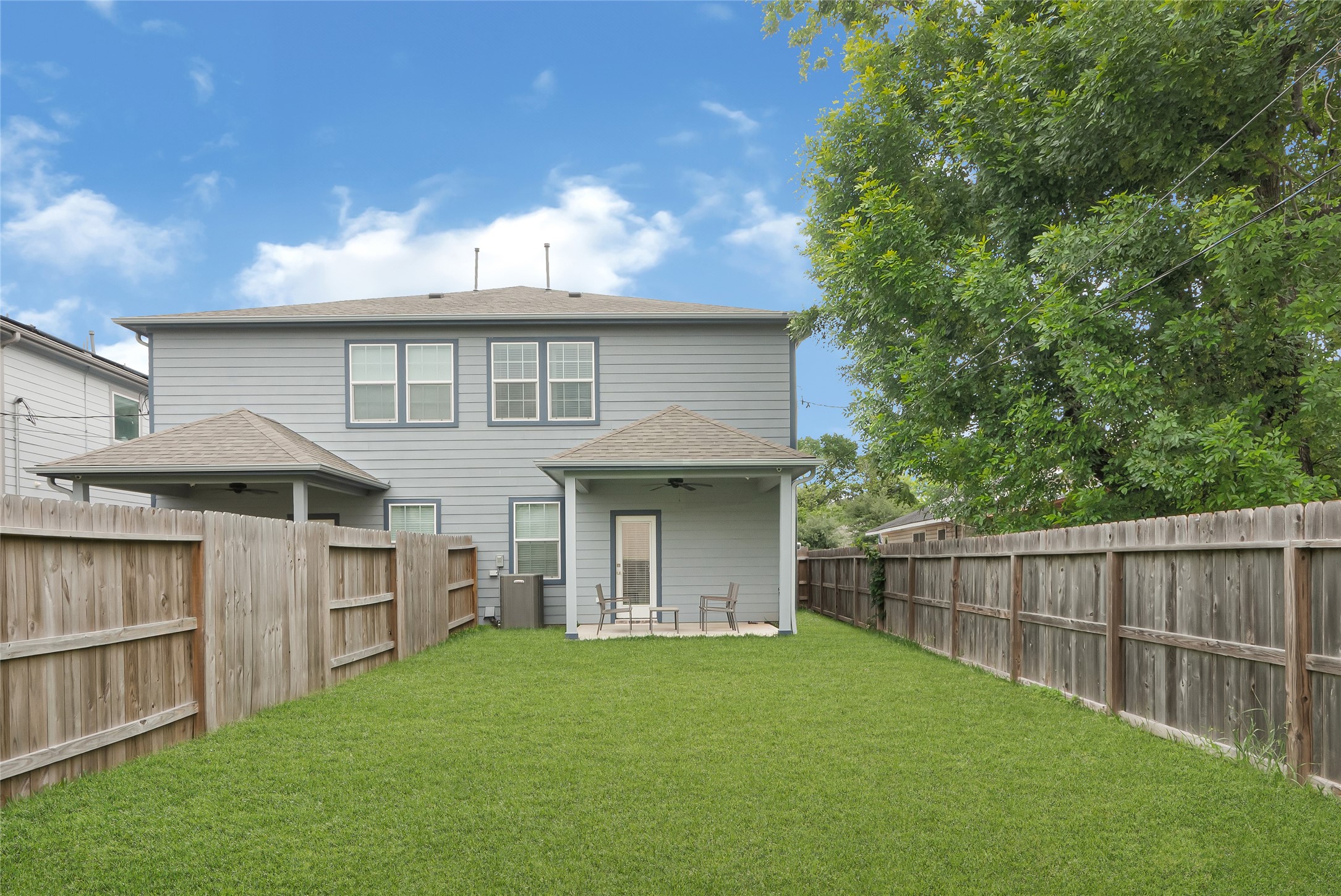 10021 Alfred Lane, Unit A Houston, TX 77041 - Photo 4 of 29 a view of a house with a yard and a large tree