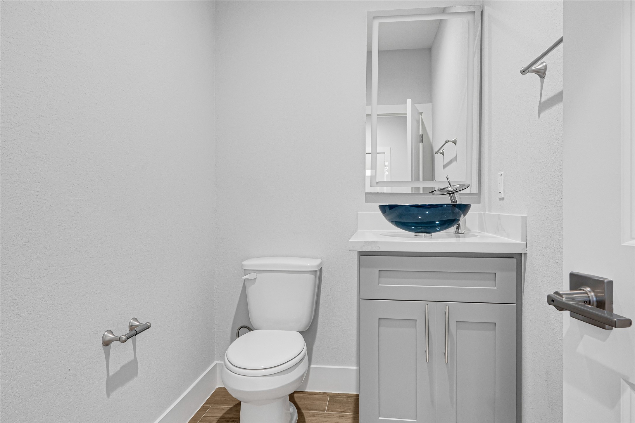 10021 Alfred Lane, Unit A Houston, TX 77041 - Photo 9 of 29 a bathroom with a toilet sink and mirror