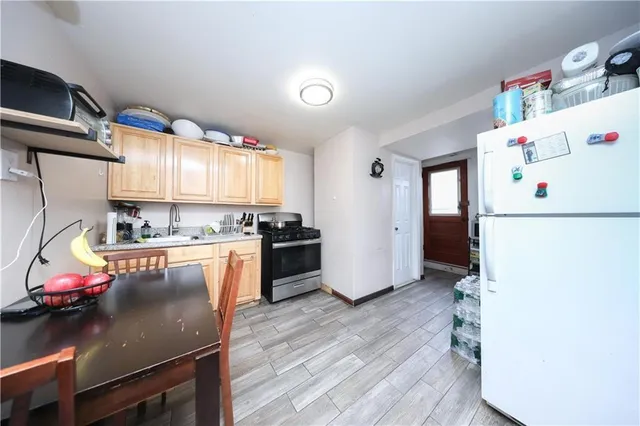 a view of a stairs and wooden floor
