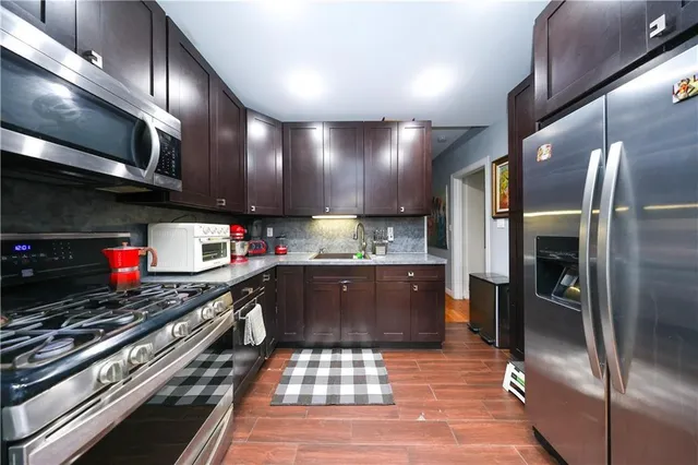 a living room with furniture potted plant and a window