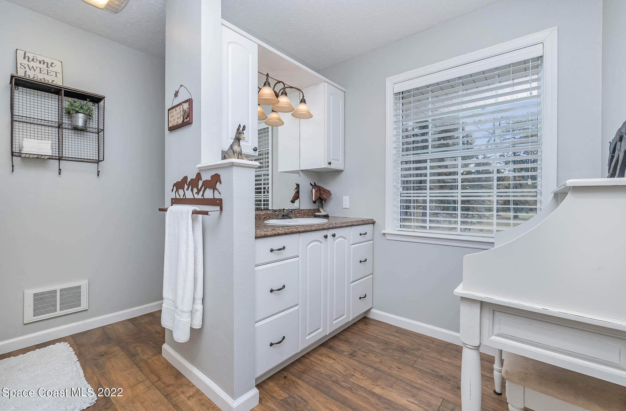 3895 Corey Road Malabar, FL 32950 - Photo 12 of 21 a bedroom with a bed and a window