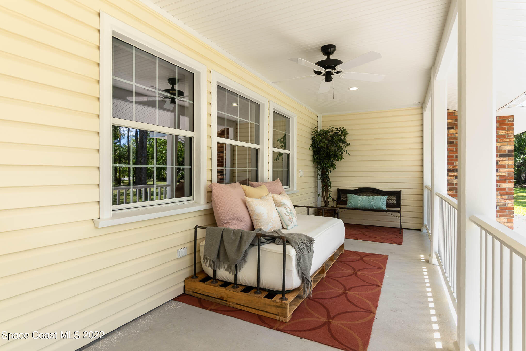 3895 Corey Road Malabar, FL 32950 - Photo 2 of 21 a living room with furniture and a window