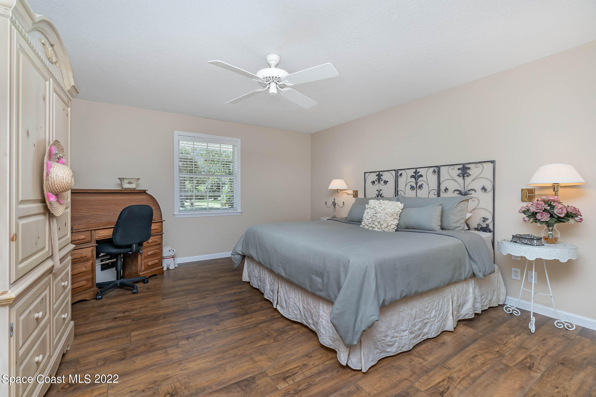3895 Corey Road Malabar, FL 32950 - Photo 8 of 21 a bed room with a bed and a chair