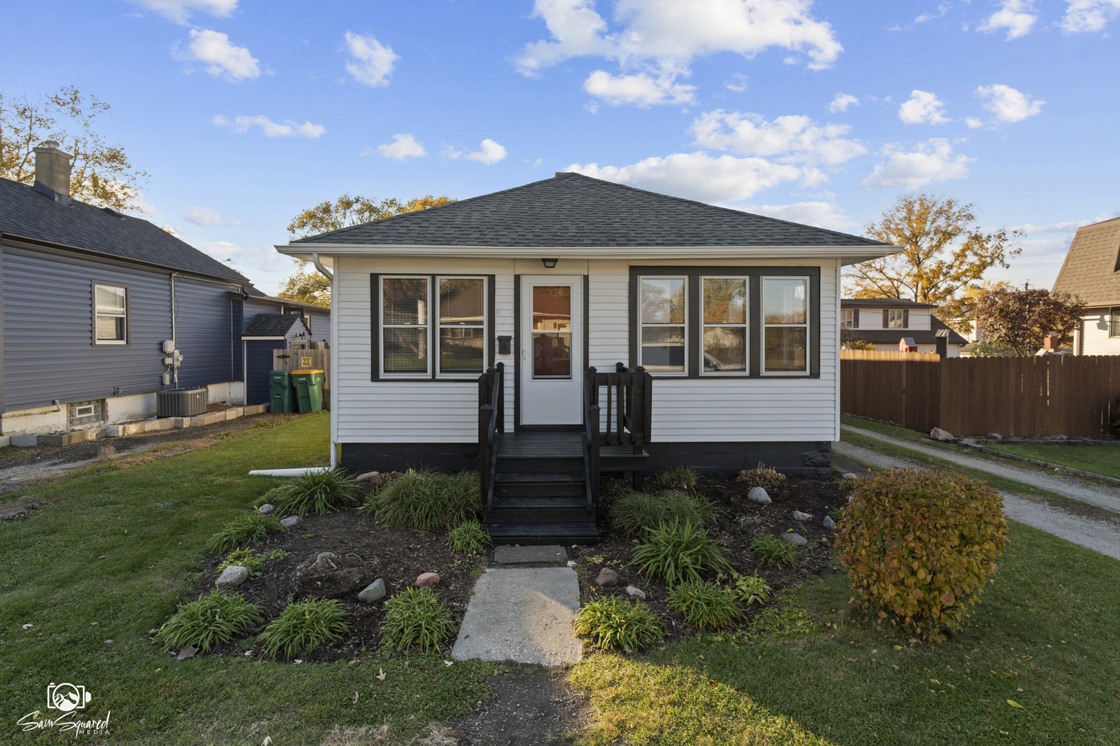 a front view of a house with garden