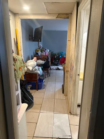 a bedroom with a bed and a mirror