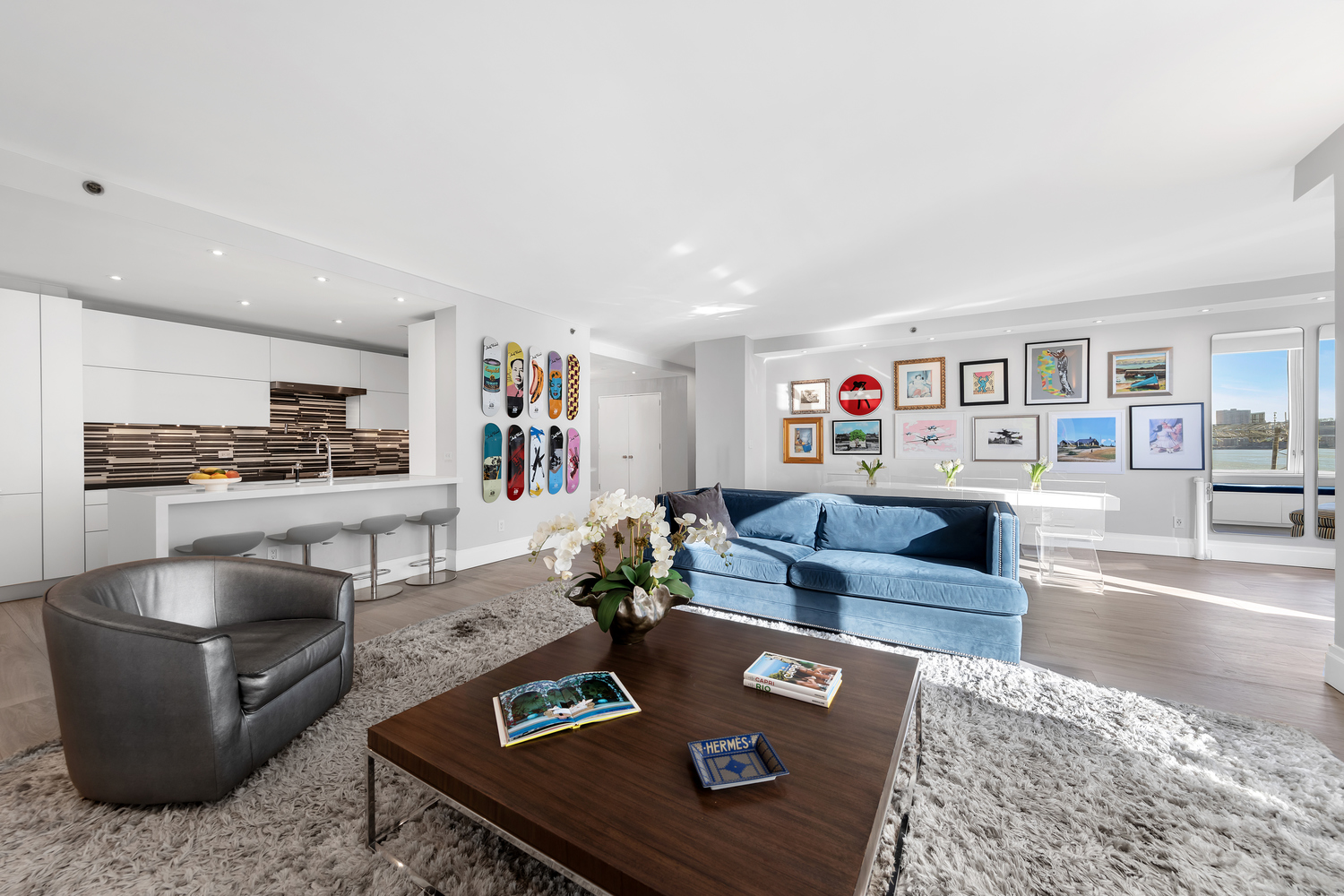 220 Riverside Boulevard, Unit 4H Manhattan, NY 10069 - Photo 3 of 15 a living room with furniture and a table