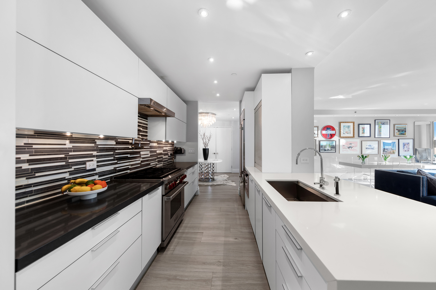 220 Riverside Boulevard, Unit 4H Manhattan, NY 10069 - Photo 5 of 15 a kitchen with stainless steel appliances a stove and cabinets