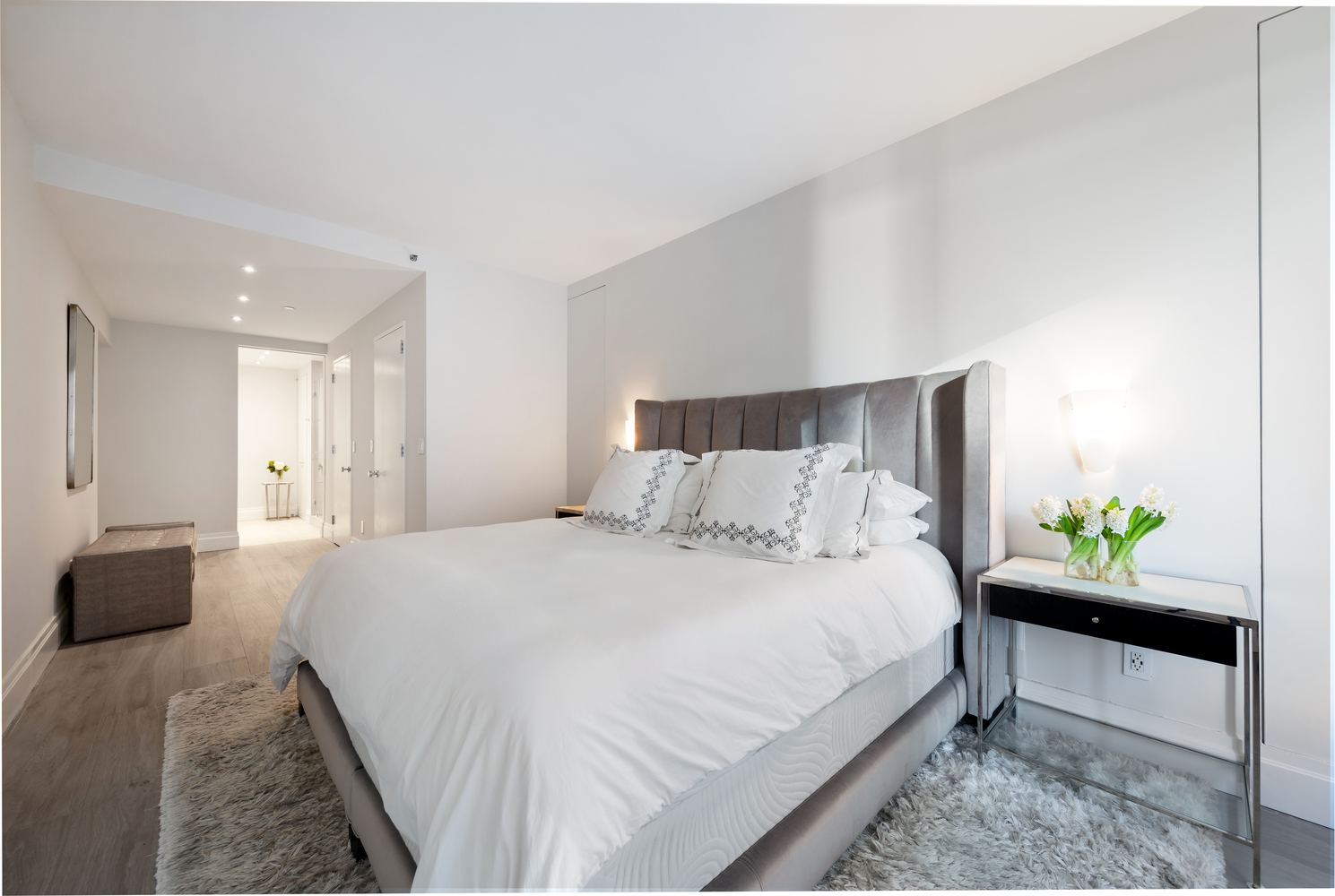 220 Riverside Boulevard, Unit 4H Manhattan, NY 10069 - Photo 9 of 15 a bedroom with a bed and a couch