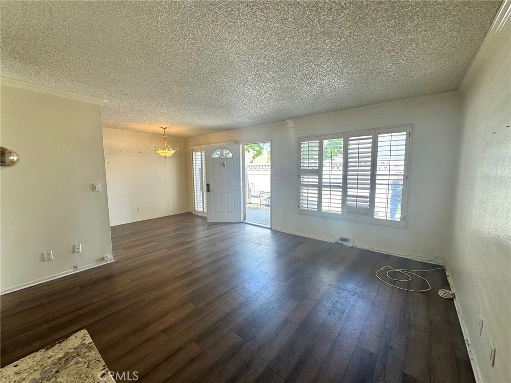 8939 Gallatin Road, Unit 16 Pico Rivera, CA 90660 - Photo 3 of 17 FAMILY ROOM LOOKING AT DOOR