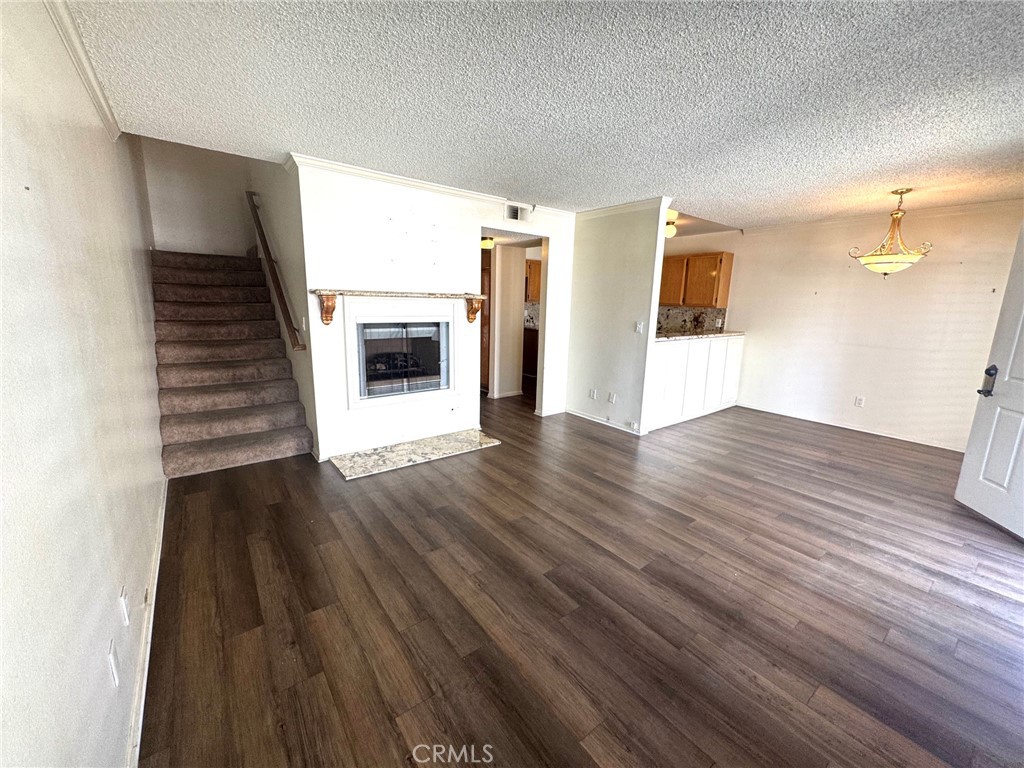 8939 Gallatin Road, Unit 16 Pico Rivera, CA 90660 - Photo 4 of 17 LIVING TO FIREPLACE
