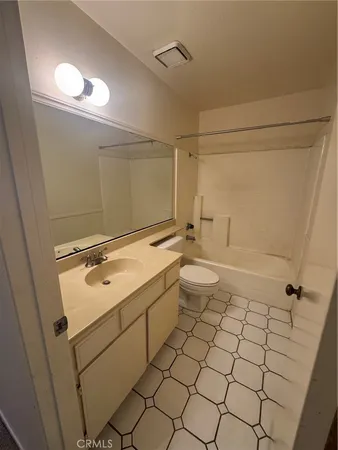 a bathroom with a sink and toilet