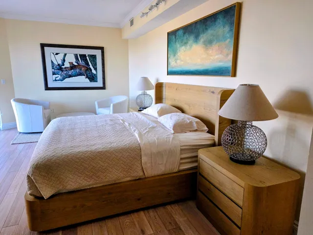 a bathroom with a granite countertop sink mirror and bathtub