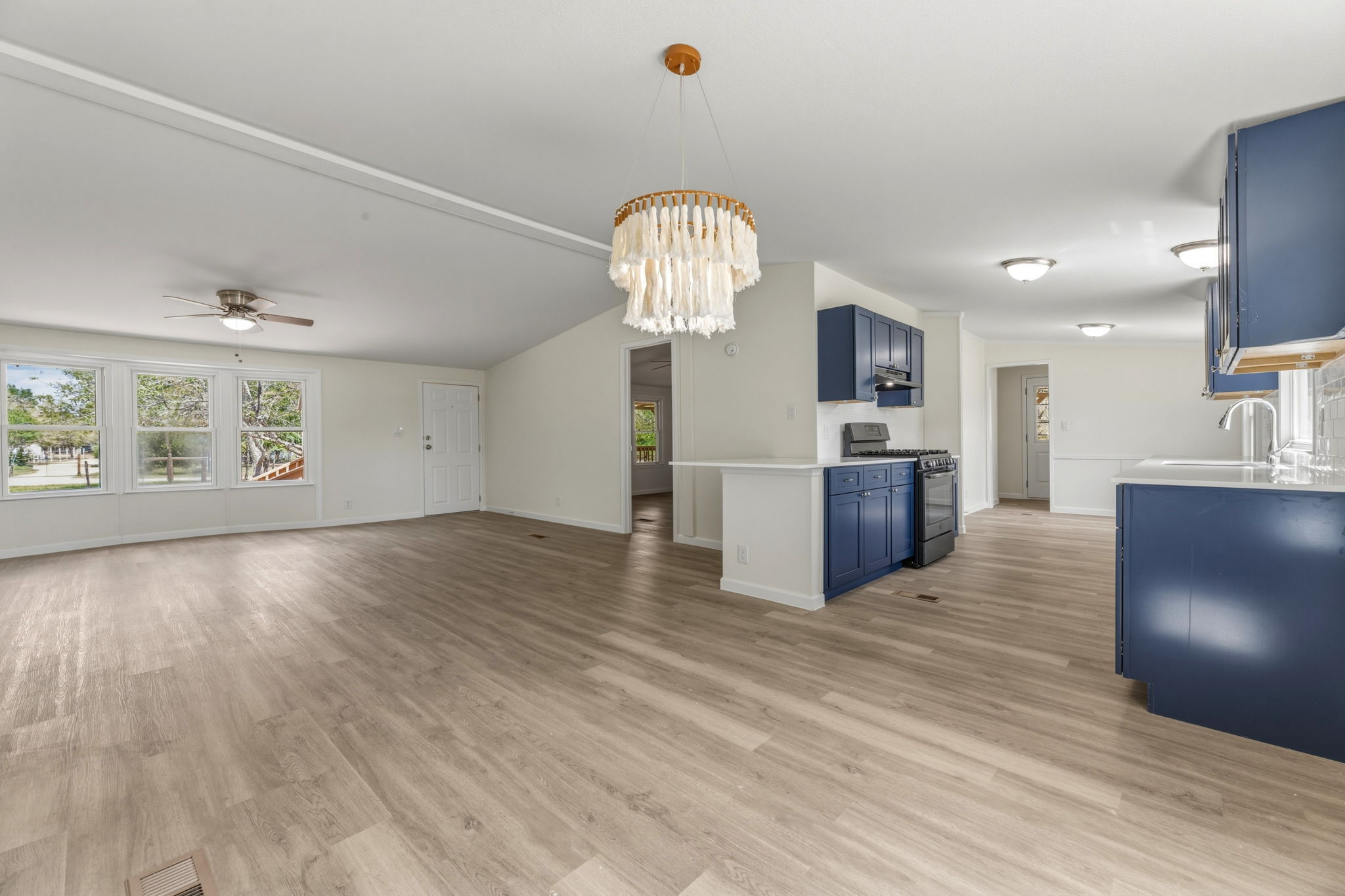 340 Red Hawk Drive Dale, TX 78616 - Photo 13 of 38 Open concept dining area and living room with vaulted ceilings