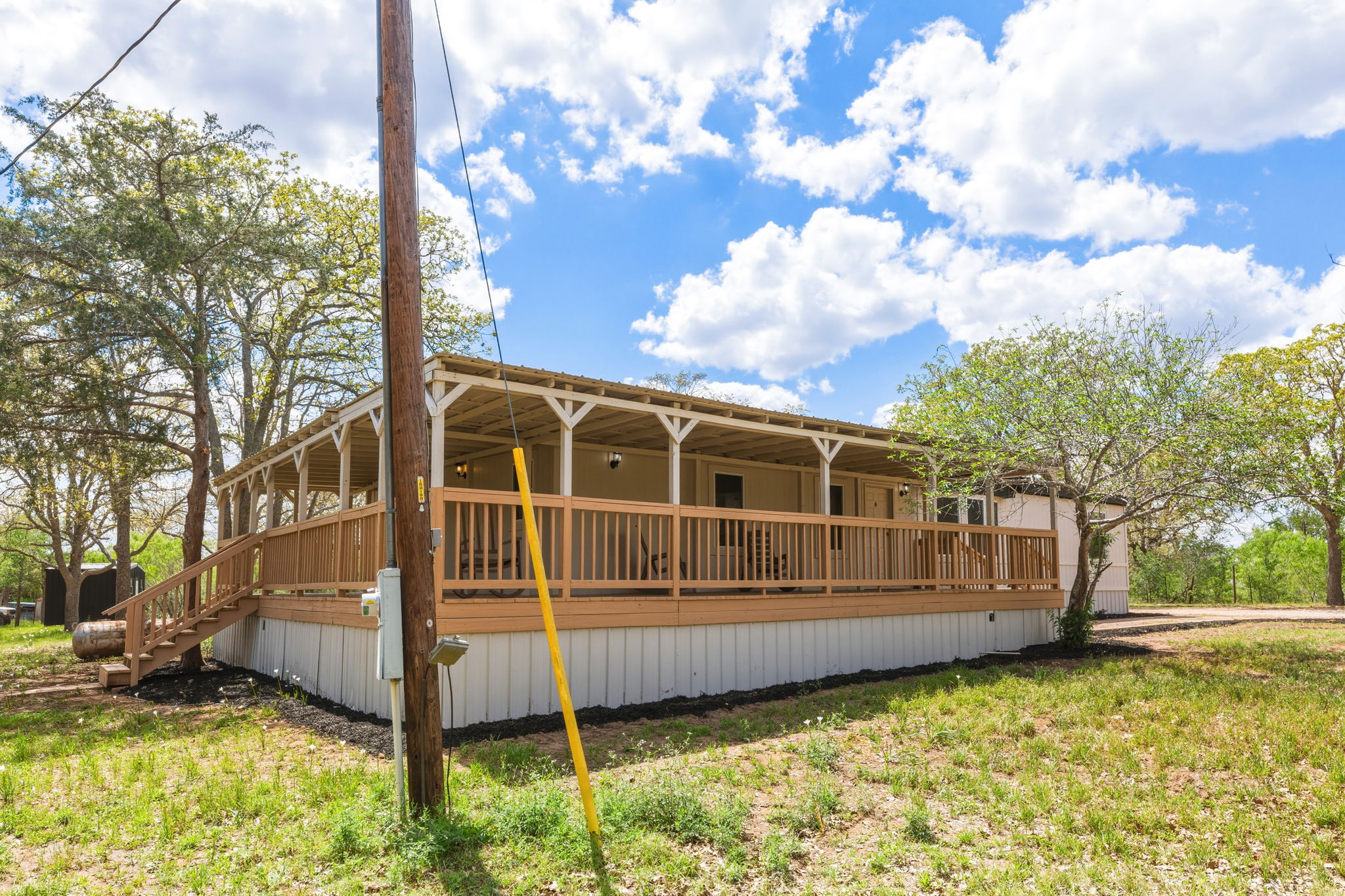 340 Red Hawk Drive Dale, TX 78616 - Photo 3 of 38 Front view of house featuring a wrap around porch.