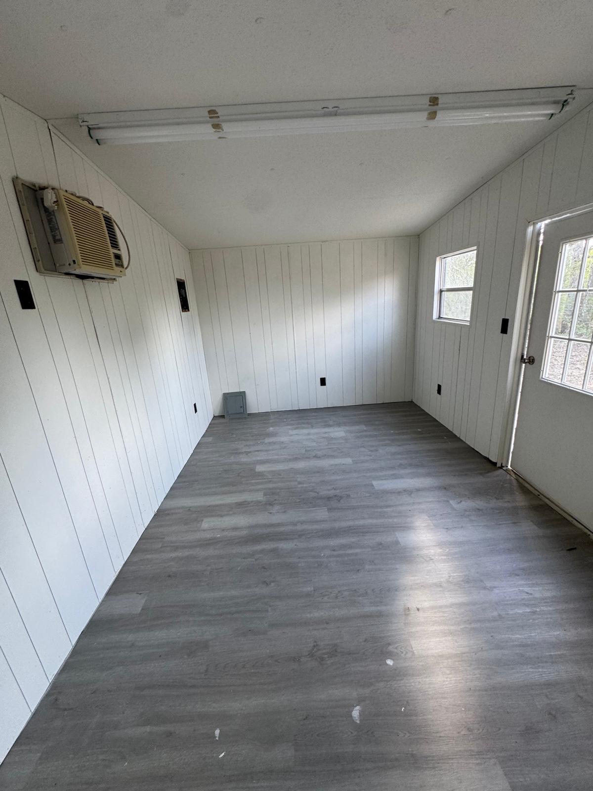 340 Red Hawk Drive Dale, TX 78616 - Photo 10 of 38 Interior of black shed with AC unit .