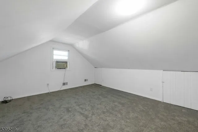 a view of a house with backyard and deck