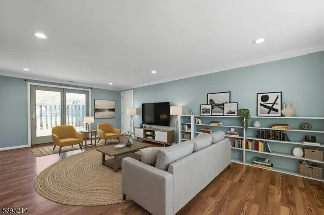 a view of room with wooden floor and windows