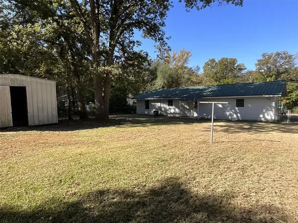 a house view with swimming pool in front of it
