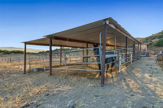 a view of a room with wooden floor and windows