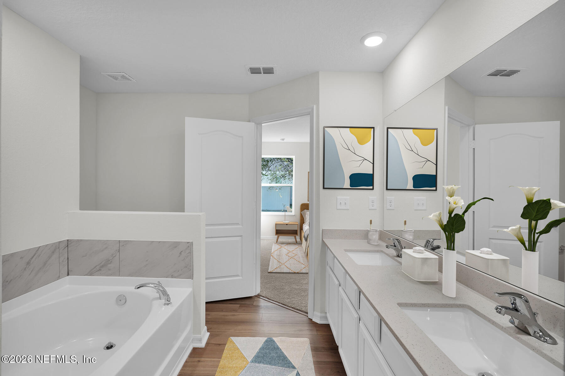 6967 Canoe Birch Road Jacksonville, FL 32219 - Photo 14 of 20 a spacious bathroom with a bathtub sink and mirror