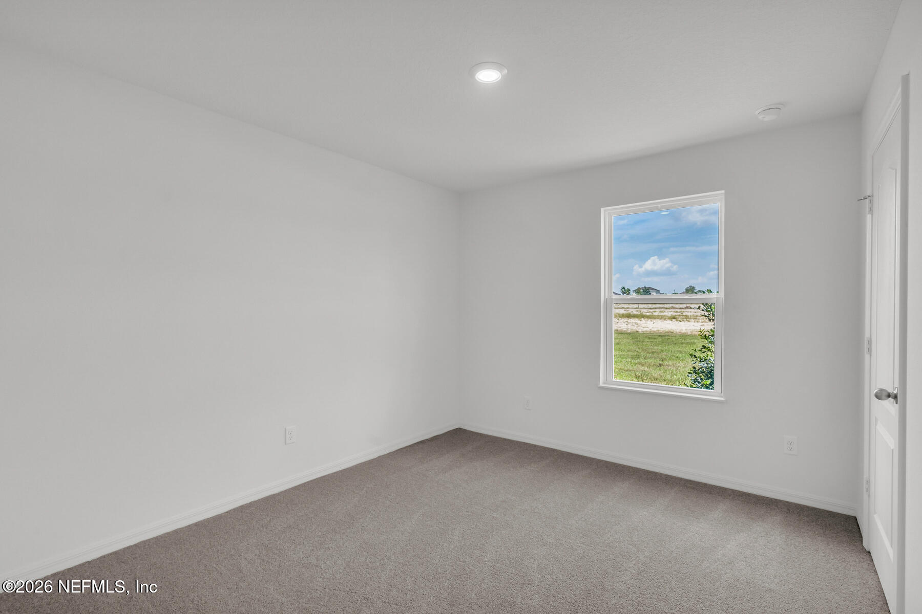 6967 Canoe Birch Road Jacksonville, FL 32219 - Photo 16 of 20 an empty room with a window