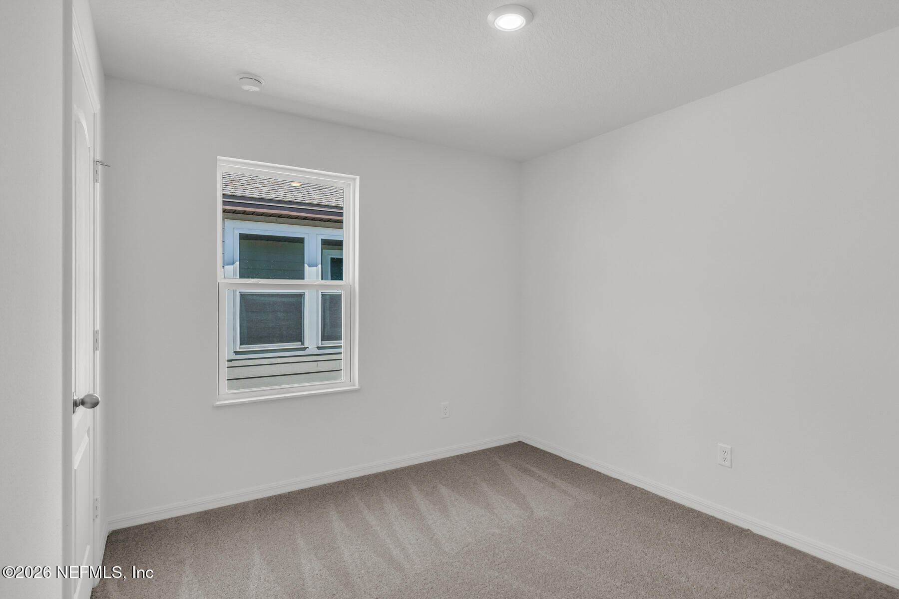 6967 Canoe Birch Road Jacksonville, FL 32219 - Photo 19 of 20 a view of an empty room with a window