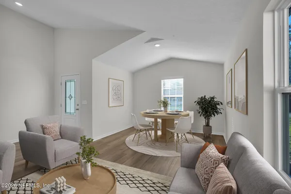 a living room with furniture and a table