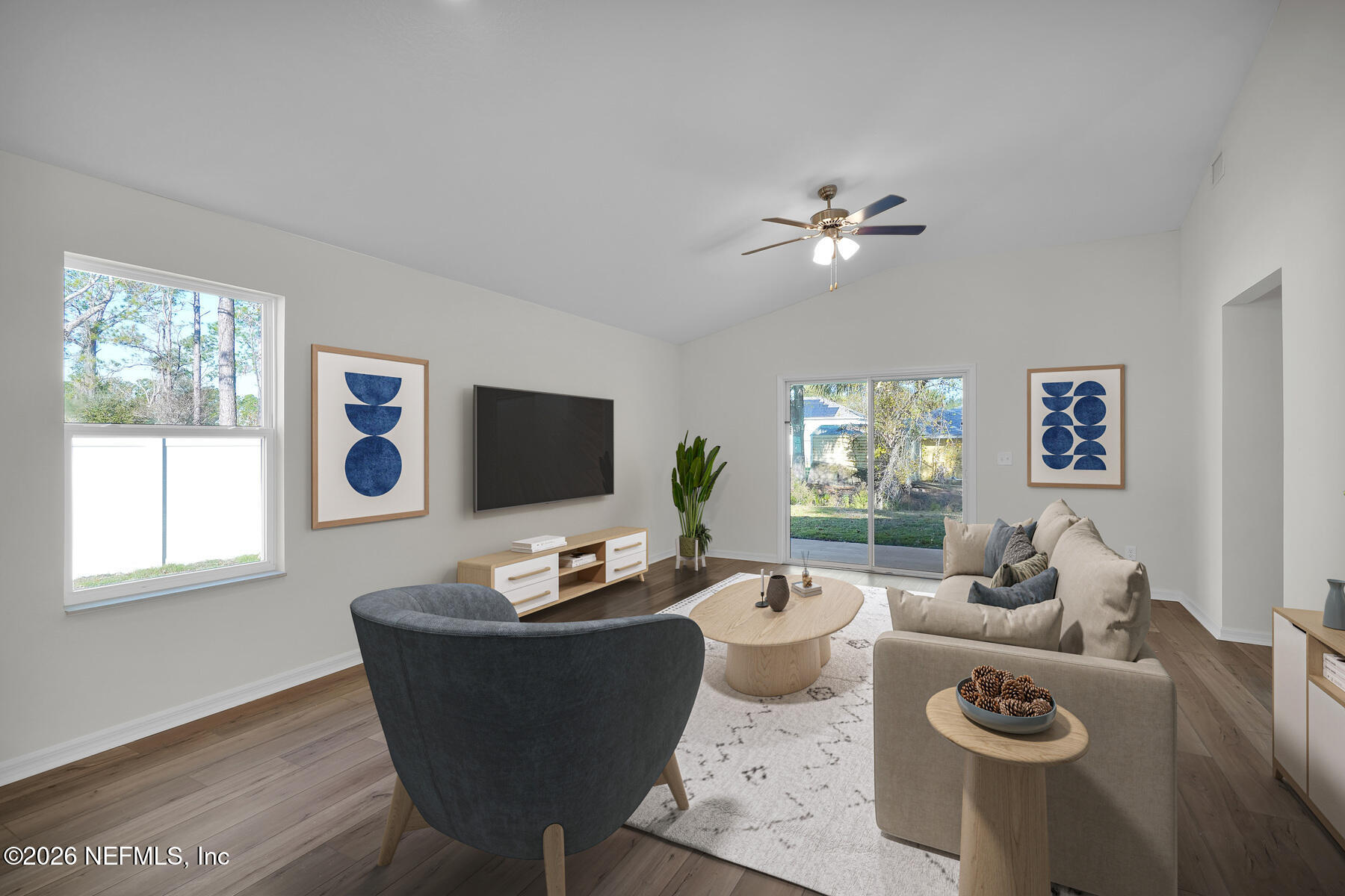 6967 Canoe Birch Road Jacksonville, FL 32219 - Photo 9 of 20 a living room with furniture a flat screen tv and a window