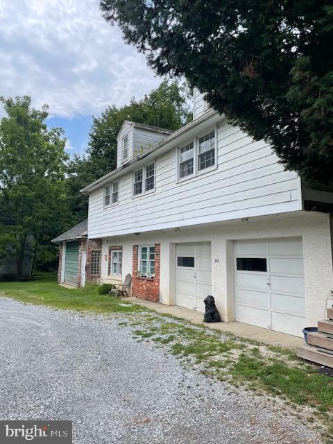 323 East Street Road Kennett Square, PA 19348 - Photo 2 of 6 a front view of a house with garden