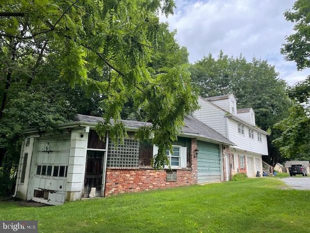 323 East Street Road Kennett Square, PA 19348 - Photo 3 of 6 a view of a house with a yard and sitting area