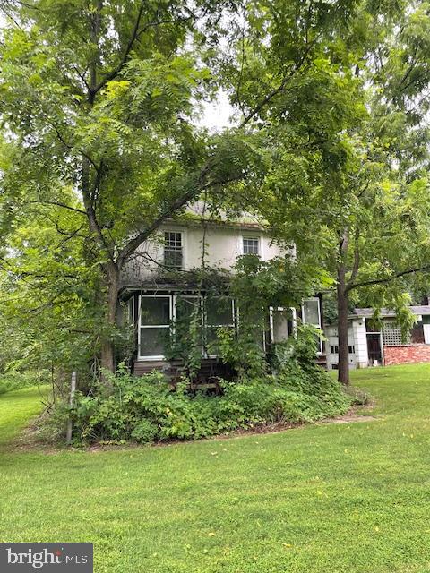 323 East Street Road Kennett Square, PA 19348 - Photo 5 of 6 a backyard of a house with lots of green space