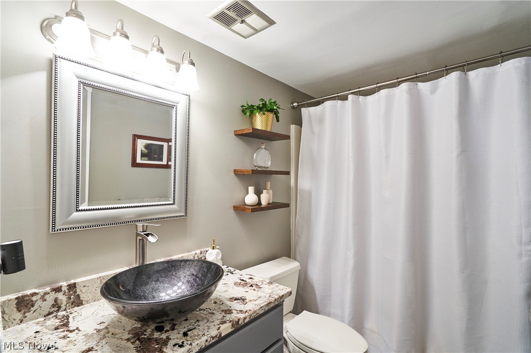 874 Hampton Ridge Drive Akron, OH 44313 - Photo 13 of 30 Second bathroom with granite countertop on gray vanity