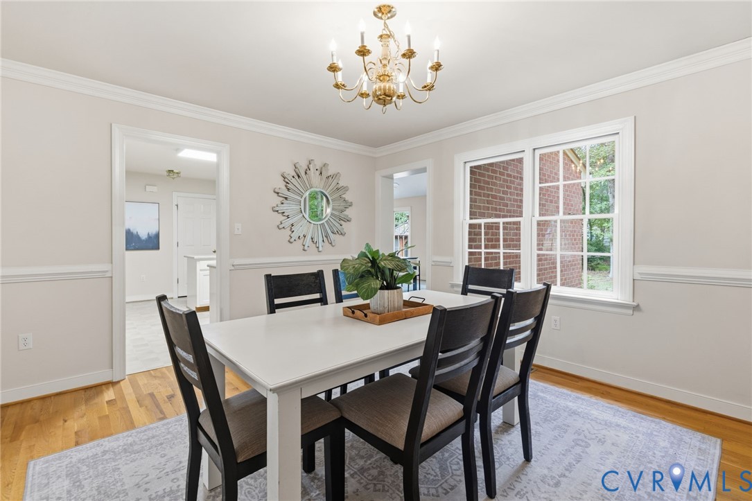 2615 Salisbury Road Midlothian, VA 23113 - Photo 11 of 36 a view of a dining room with furniture and chandelier