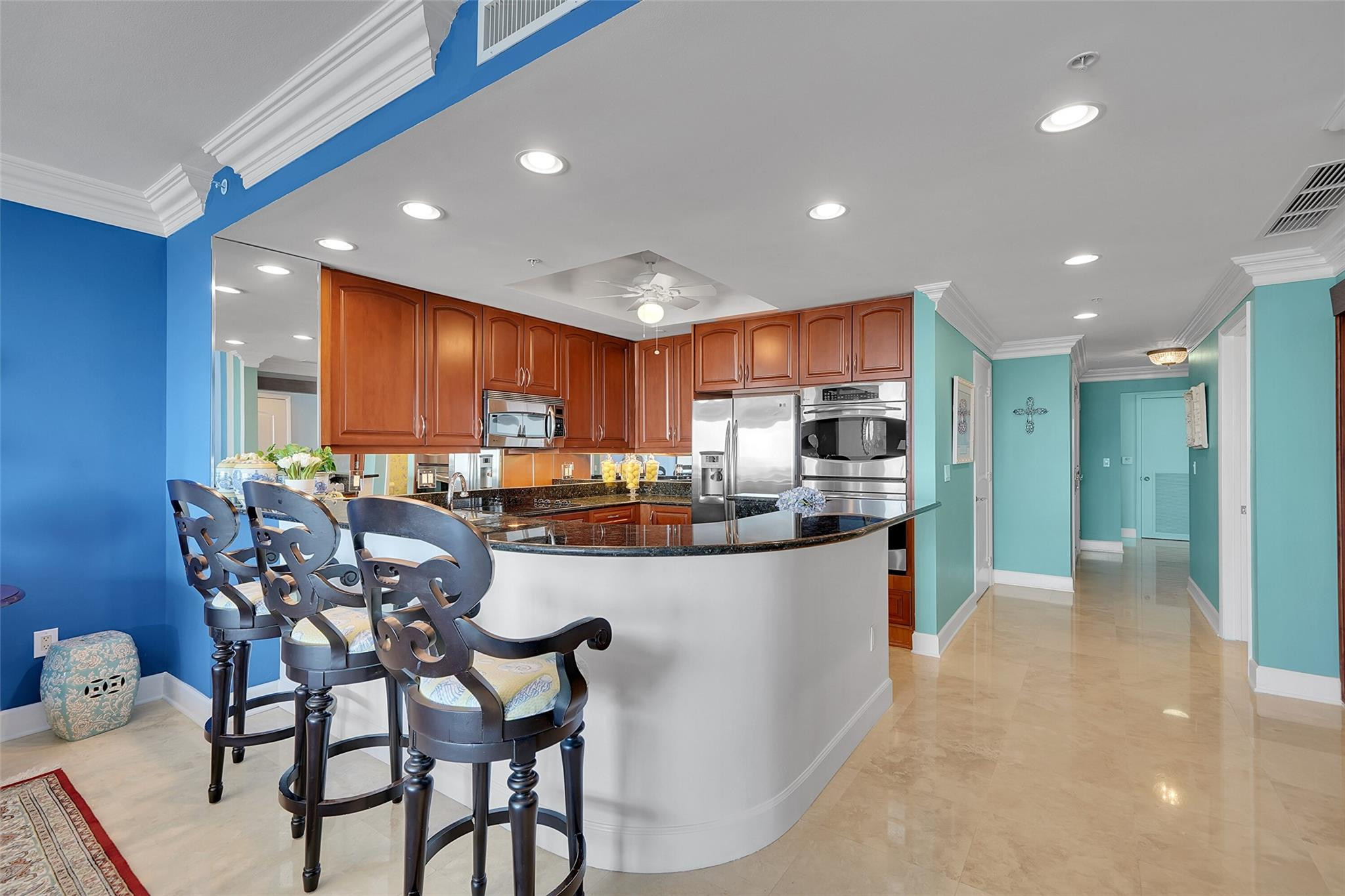 821 North Riverside Drive, Unit PH2 Pompano Beach, FL 33062 - Photo 18 of 95 a kitchen with stainless steel appliances kitchen island granite countertop a sink and cabinets