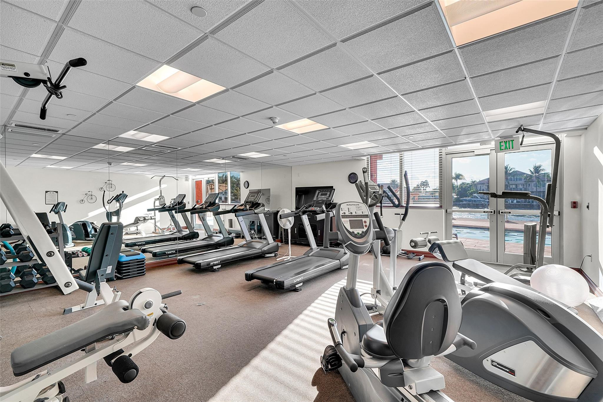 821 North Riverside Drive, Unit PH2 Pompano Beach, FL 33062 - Photo 91 of 95 a view of a room with gym equipment