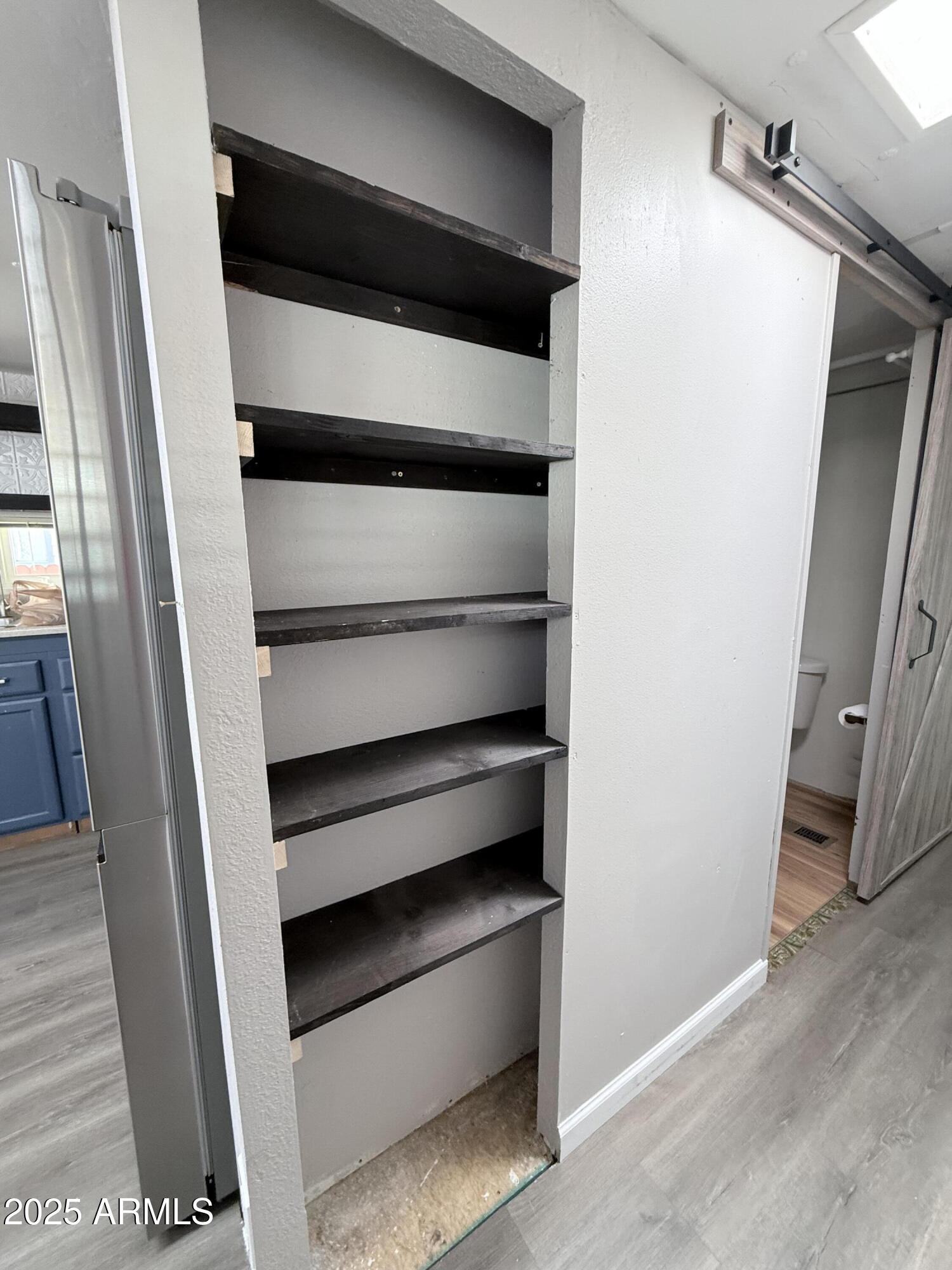 960 Peace Lane, Unit 77 Prescott, AZ 86305 - Photo 11 of 27 a view of walk in closet with empty racks