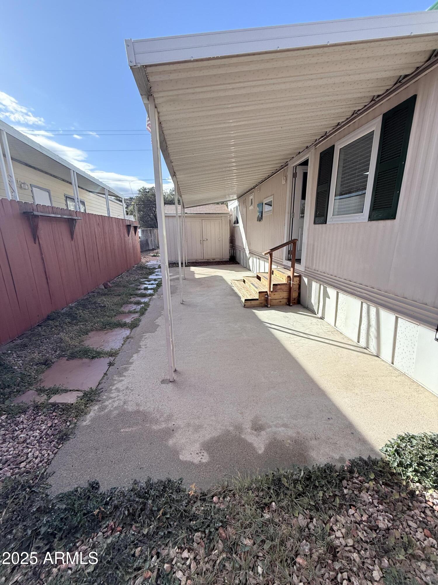 960 Peace Lane, Unit 77 Prescott, AZ 86305 - Photo 14 of 27 a view of a back yard of the house