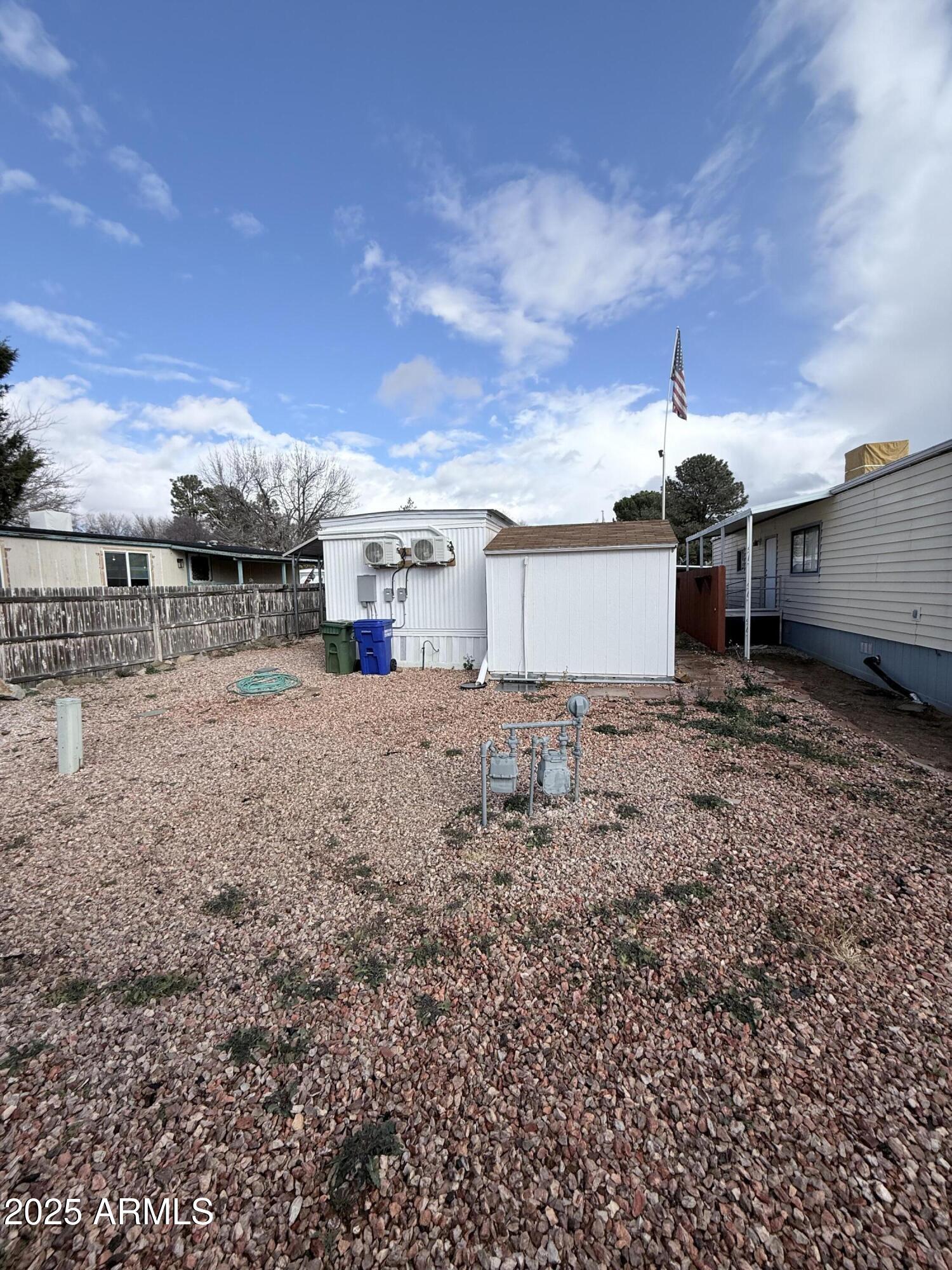 960 Peace Lane, Unit 77 Prescott, AZ 86305 - Photo 5 of 27 a view of a house with a yard