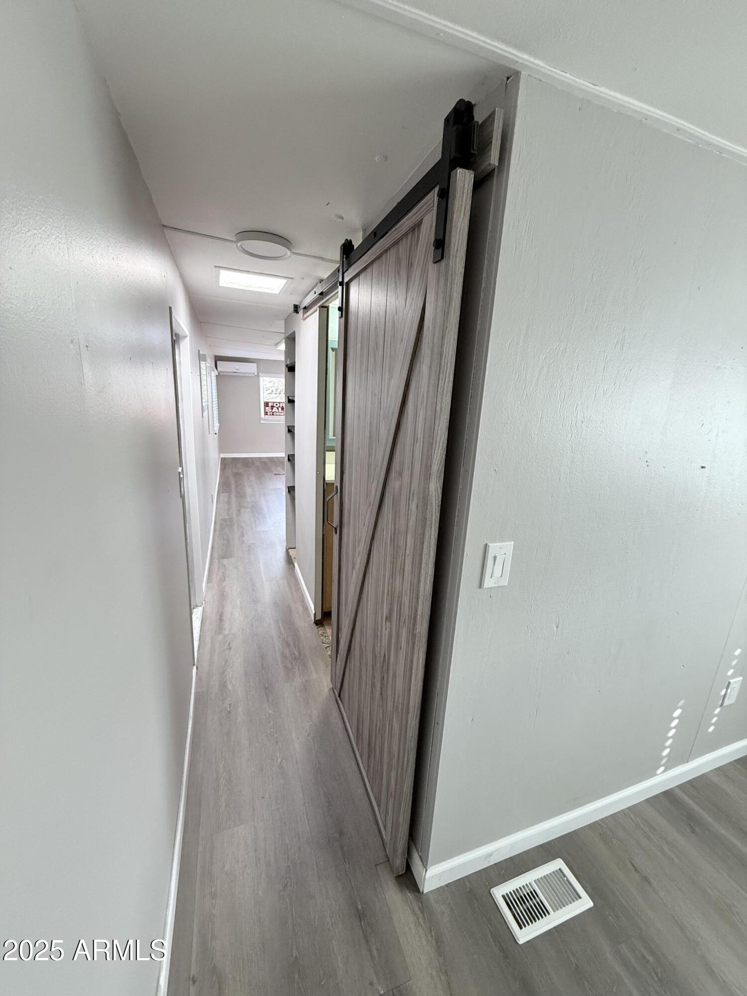 960 Peace Lane, Unit 77 Prescott, AZ 86305 - Photo 8 of 27 a view of a hallway with wooden floor