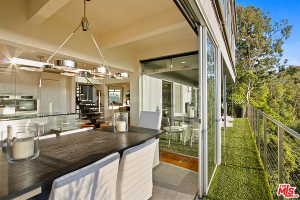 a kitchen with stainless steel appliances granite countertop a sink and a stove