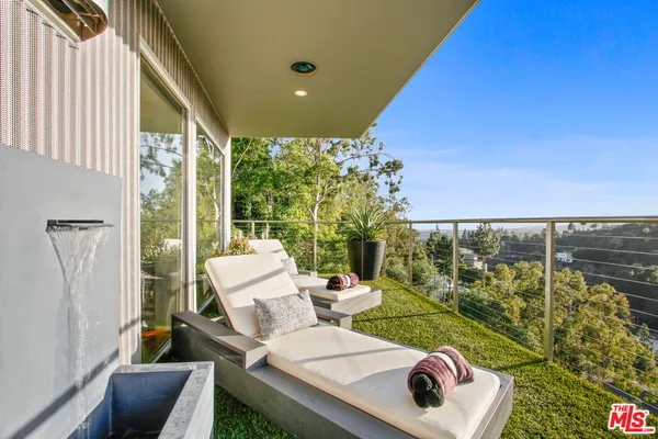 a house view with a sitting space and garden view