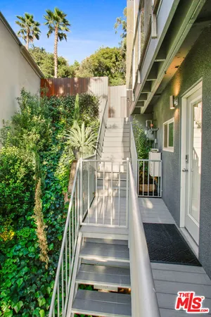 a view of a balcony with chairs