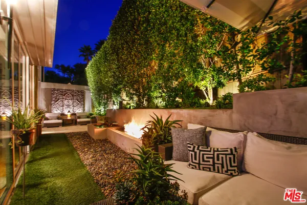 swimming pool view with a seating space