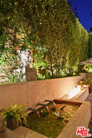 a view of backyard with outdoor seating